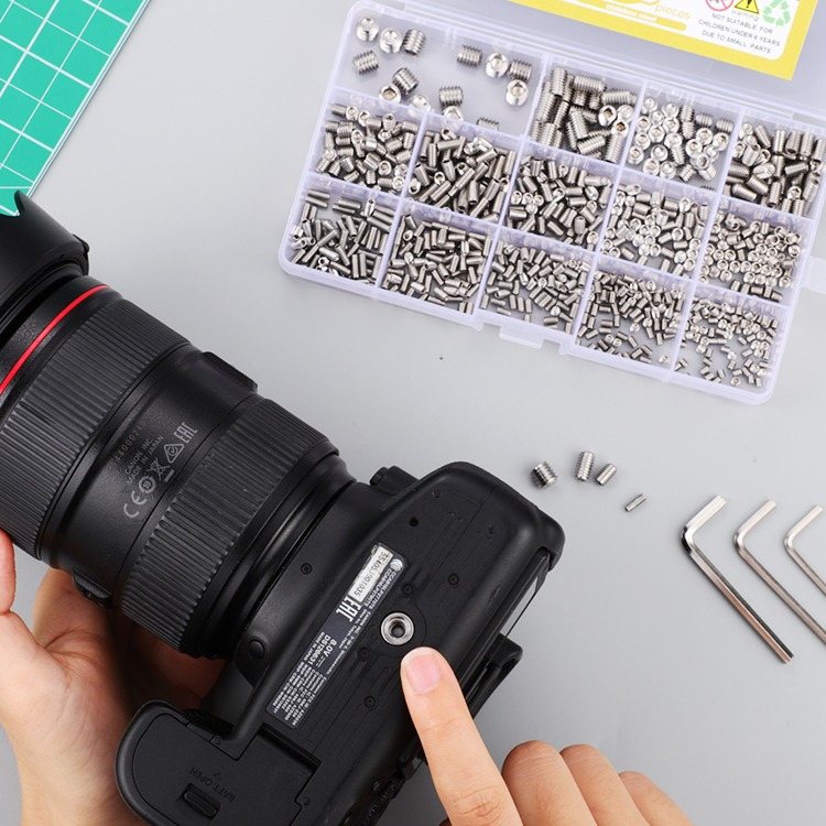 Camera on a cutting mat next to an open Hapric metric screw assortment case
